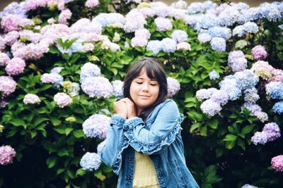 Portrait of smiling girl with flowers