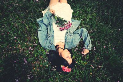 Girl standing on grassy field