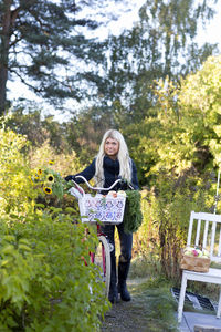 Young woman with bicycle, stockholm, sweden