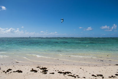 Scenic view of sea against blue sky