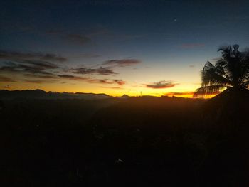 Scenic view of silhouette landscape against sky during sunset