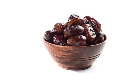 Close-up of ice cream in bowl against white background