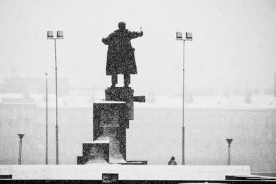 Statue of liberty against sky during winter