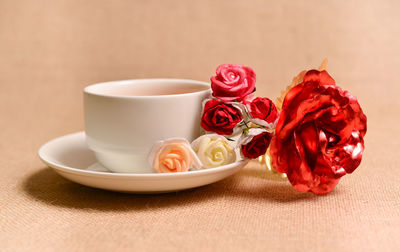 Close-up of red roses on table