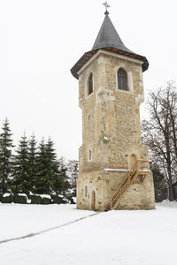 Low angle view of building against sky during winter