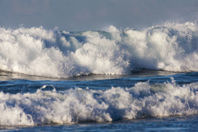 Waves on the sandy beach in hikkaduwa, sri lanka