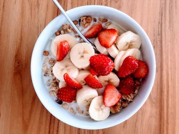 High angle view of chopped fruits in bowl on table