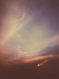 Scenic view of dramatic sky at sunset