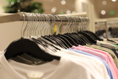 Close-up of clothes hanging in store