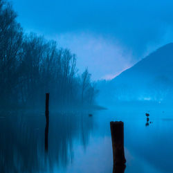 Rear view of woman walking on snow covered landscape