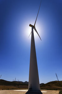 Spain, andalusia, wind turbine against the sun
