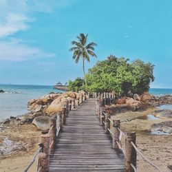 View of jetty leading to sea