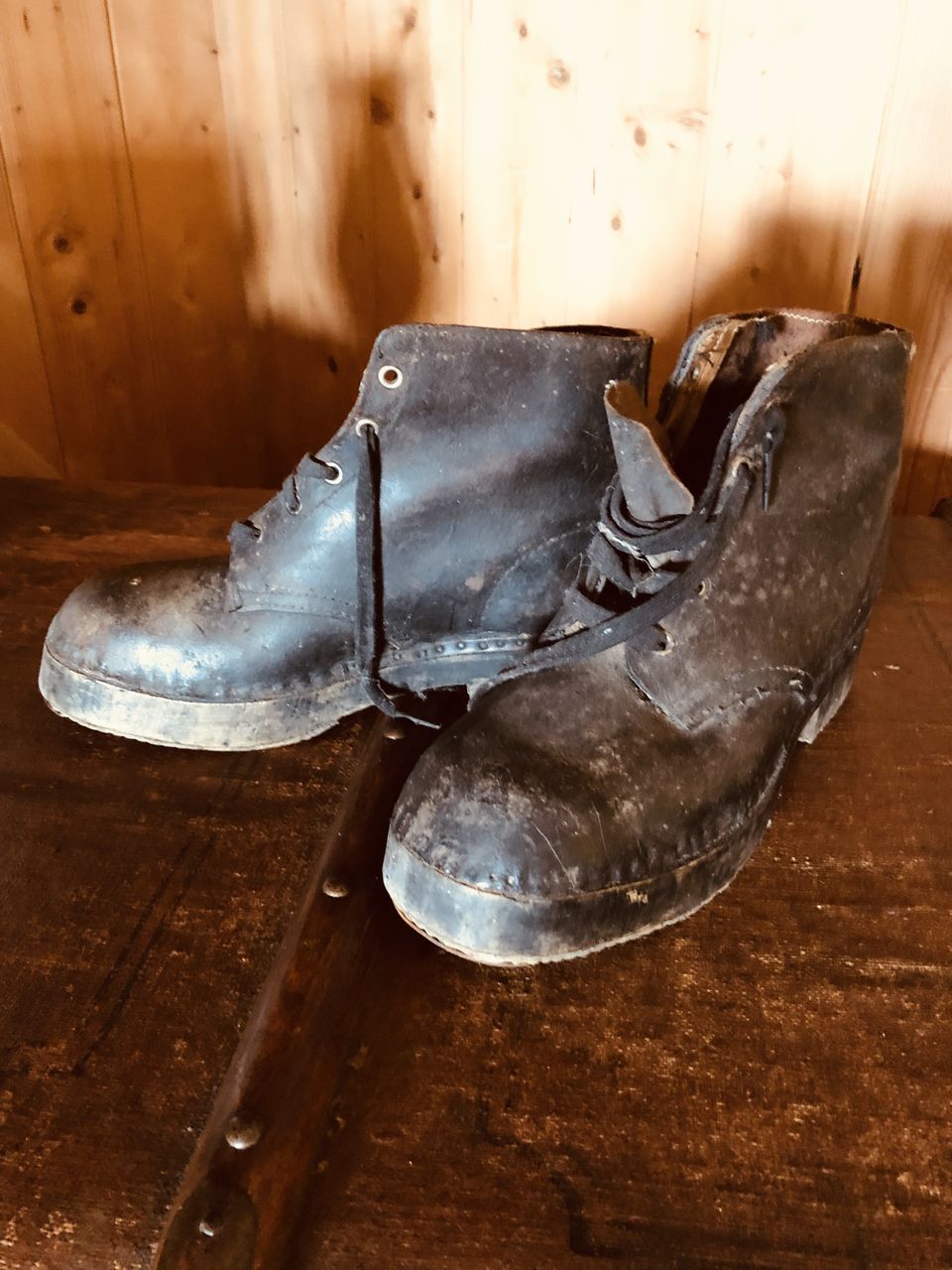 HIGH ANGLE VIEW OF SHOES ON WOOD