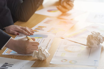 Close-up of business colleagues working in office