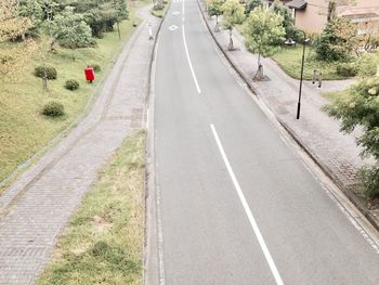 Road amidst trees against sky