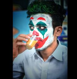 Portrait of young man holding ice cream