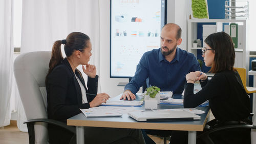 Group of people working on table