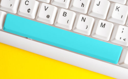 High angle view of computer keyboard on table