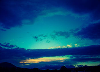 Low angle view of cloudy sky at sunset