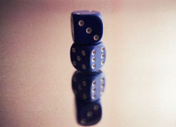 Close-up of camera on table against gray background