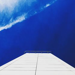 Close-up of swimming pool against blue sky