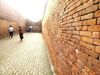 People walking on cobblestone street