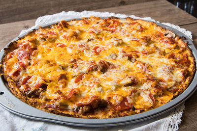 Close-up of pizza served on table