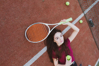 High angle view of woman playing with ball