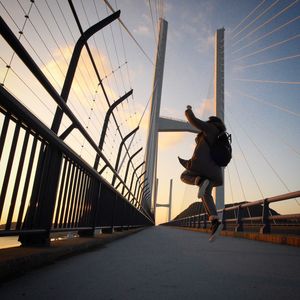 Low angle view of people against sky