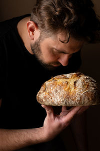 Close-up of man holding food