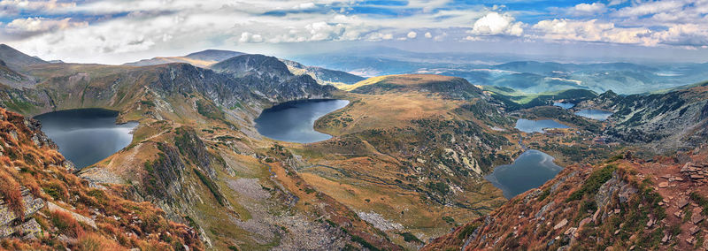 Panoramic view of landscape against cloudy sky