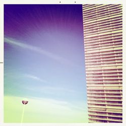 Low angle view of building against blue sky