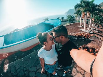 Young couple kissing in water