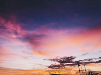 Low angle view of dramatic sky during sunset