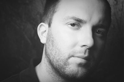 Close-up portrait of young man with stubble