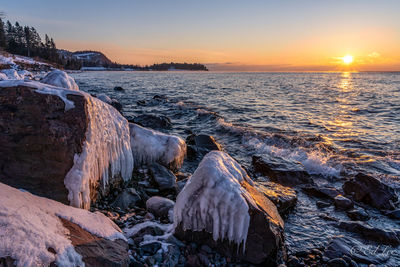 Panoramic view of sea against sky during sunset