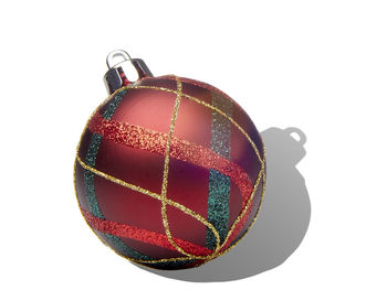 Close-up of multi colored ball against white background