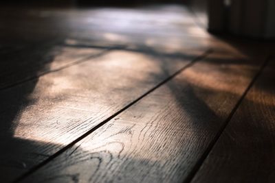 Close-up of shadow on hardwood floor