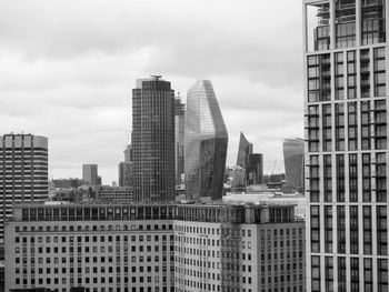 Modern buildings in city against sky