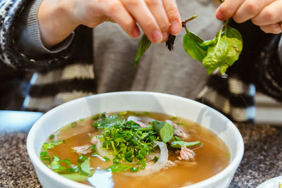 Midsection of man preparing food