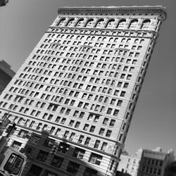 Low angle view of office building against sky