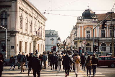 People walking on street in city