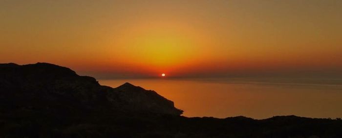 Scenic view of sea at sunset