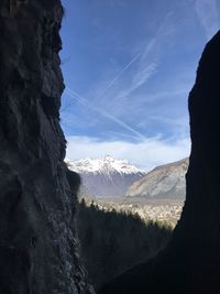 Scenic view of snowcapped mountains against sky