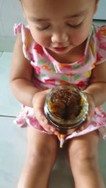 Midsection of woman holding ice cream