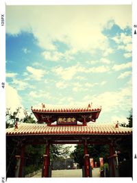 Low angle view of built structure against cloudy sky