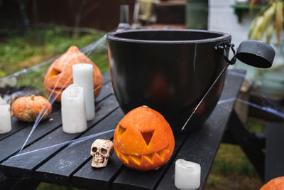 Close-up of pumpkin and beer on table