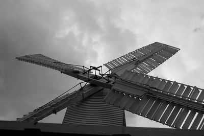 Low angle view of traditional windmill against sky