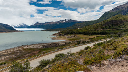 Scenic view of landscape and mountains against sky