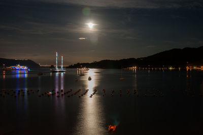 Reflection of illuminated buildings in water